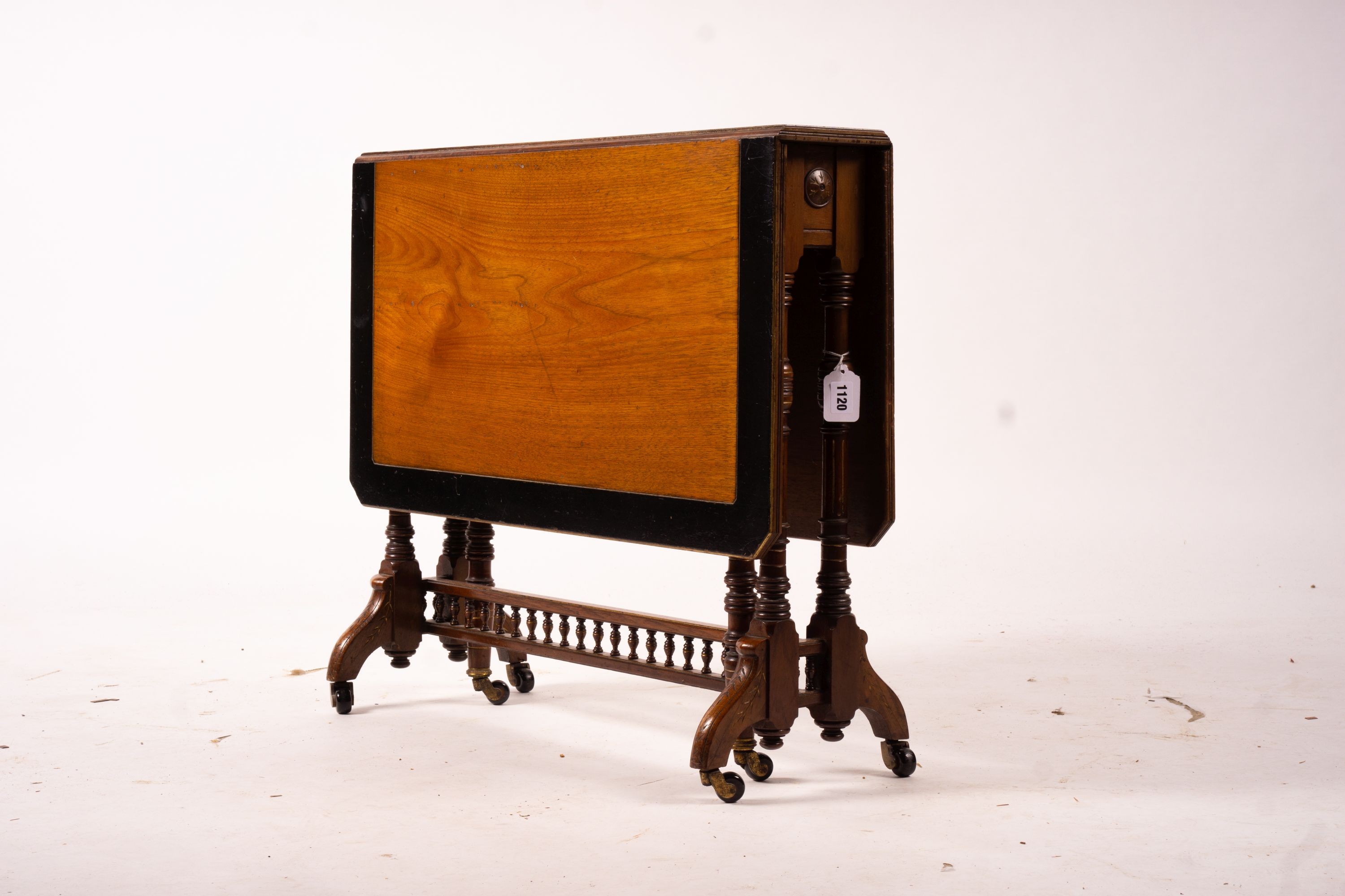 A late Victorian part ebonised walnut Sutherland table, width 76cm, depth 15cm, height 65cm